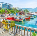 The boats and bicycle in Alanya port Royalty Free Stock Photo