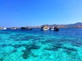 The Boats on Blue and Turquoise Clear Water at Taka Makassar Island in Komodo National Park, Indonesia