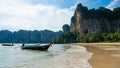 Boats on the blue water of the ocean surrounded by cliffs