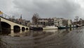 Boats, bridge and old buildings at Amsterdam water canals