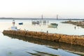 Boats and bridge over Guadiana river which is a border between Spain and Portugal Royalty Free Stock Photo