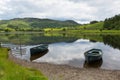 Boats calm water Watendlath Tarn Lake District Cumbria England UK Royalty Free Stock Photo