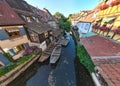 Boats in Canal of La Petite Venise or Little Venice in Colmar, Alsace, France. Morning time Aerial Drone Shot Royalty Free Stock Photo