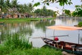 Boats on canal in tourist destination Hoi An, Vietnamese women in Hoi An, Vietnam