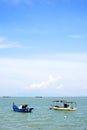 Boats with canopy anchored waiting tourists in Georgetown