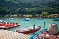 Boats and catamarans on the pier, boat rental for tourists on a lake. A picturesque place for a relaxing holiday Royalty Free Stock Photo