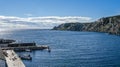 Boats at a cliffside dockhouse in Twillingate, Newfoundland. Royalty Free Stock Photo