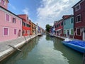 Boats and colorful traditional painted houses in a canal street houses of Burano island, Venice, Italy Royalty Free Stock Photo