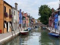 Boats and colorful traditional painted houses in a canal street houses of Burano island, Venice, Royalty Free Stock Photo