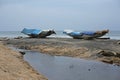 Boats waiting for fairer weather in Varkala, India Royalty Free Stock Photo