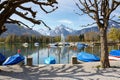 Boats covered with tarpaulin on Walensee lake on a sunny spring day. Weesen, Switzerland Royalty Free Stock Photo