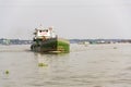 Boats crossing Mekong river in My Tho, Vietnam.