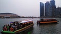 Boats crossing towards finance buildings in Singapore Royalty Free Stock Photo