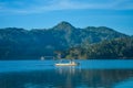 Boats crossing the water of the Sermo Reservoir Royalty Free Stock Photo