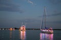 Power and Sailboats Participate in a Holida Boat Parade Royalty Free Stock Photo