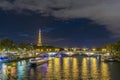 Boats Cruises Over Seine River and Bridges at Night With Eiffel Tower Royalty Free Stock Photo