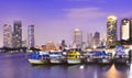 Boats cruising on the Chao Praya River in Bangkok, Thailand.