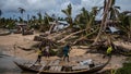 Boats and debris litter a beach after a devastating tropical storm caused widespread destruction Royalty Free Stock Photo
