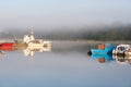 Boats in dock in foggy morning Royalty Free Stock Photo
