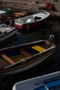 boats docked in a harbor along the coast line of a town