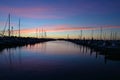 Boats docked in marina in Miami, Florida at sunrise.