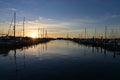 Boats docked in marina in Miami, Florida at sunrise.