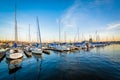 Boats docked in a marina at sunset in Canton, Baltimore, Maryland.