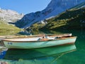 Boats in emerald-green Lake Partnun in Praettigau, Graubuenden, Switzerland. Royalty Free Stock Photo