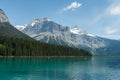 Boats on Emerald Lake, forest and mountains Royalty Free Stock Photo