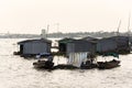 Boats with fish farm raft houses on Mekong river, Vietnam Royalty Free Stock Photo