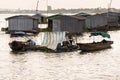 Boats with fish farm raft houses on Mekong river, Vietnam Royalty Free Stock Photo