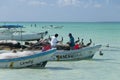 Boats with fishermen on the beach and seabirds