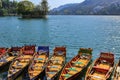 Boats floating on water in a lake in hill station Bhimtal in Nainital district of India Royalty Free Stock Photo