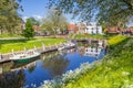 Boats and flowers in the inner harbor of Vollenhove Royalty Free Stock Photo