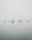 Boats on a foggy morning in Morro Bay, California Royalty Free Stock Photo