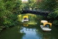 Boats going under a bridge in Luisenpark Royalty Free Stock Photo