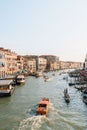 Boats and gondolas navigating through Grand Canal and the buildings from Rialto bridge in Venice, Italy Royalty Free Stock Photo