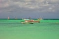 Boats on the green Caribbean sea in the tropical island of Aruba.