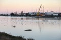 Boats harbor and crane along the river: dock seaside