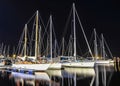 Boats in harbor at night , water reflection , stars on the sky - boat on the sea landscape - sailing vessels on dock of the bay Royalty Free Stock Photo