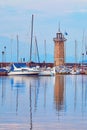 Boats in the harbour near Desenzano lighthouse on Lake Garda Royalty Free Stock Photo