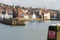 Boats in the harbour of the pretty coastal town of Whitby, UK, popular with tourists