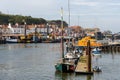 Boats in the harbour of the pretty coastal town of Whitby, UK, popular with tourists