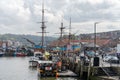 Boats in the harbour of the pretty coastal town of Whitby, UK, popular with tourists