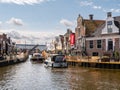 Boats in Het Dok canal near Oudesluis bridge in Lemmer, Friesland, Netherlands