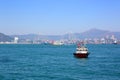 Boats in Hong Kong harbor and Stonecutters bridge Royalty Free Stock Photo