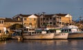 Boats and houses along the Manasquan Inlet in Point Pleasant Beach, New Jersey. Royalty Free Stock Photo