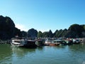 Boats and houses in a floating fishing village in Ha Long Bay. Vietnam Royalty Free Stock Photo