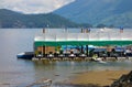 Boats and jet skis for hire on the water at harrison hot springs, bc Royalty Free Stock Photo