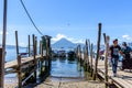 Boats, jetties & volcano, Lake Atitlan, Guatemala Royalty Free Stock Photo